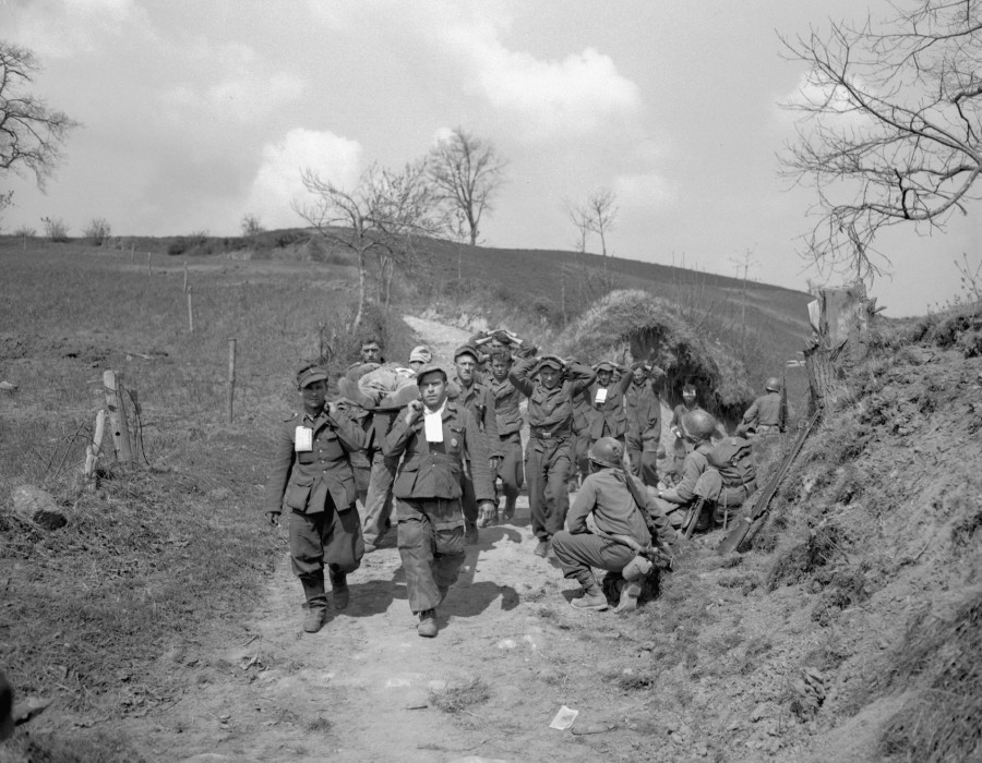 1945. thirteen german prisoners heading to the war cage.