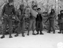 leaving the guide behind  the patrol scouts start to leave the main body of the patrol  as the patrol leader gives directions to his men as to their various jobs.0pianaccio area  italy. 24 december .