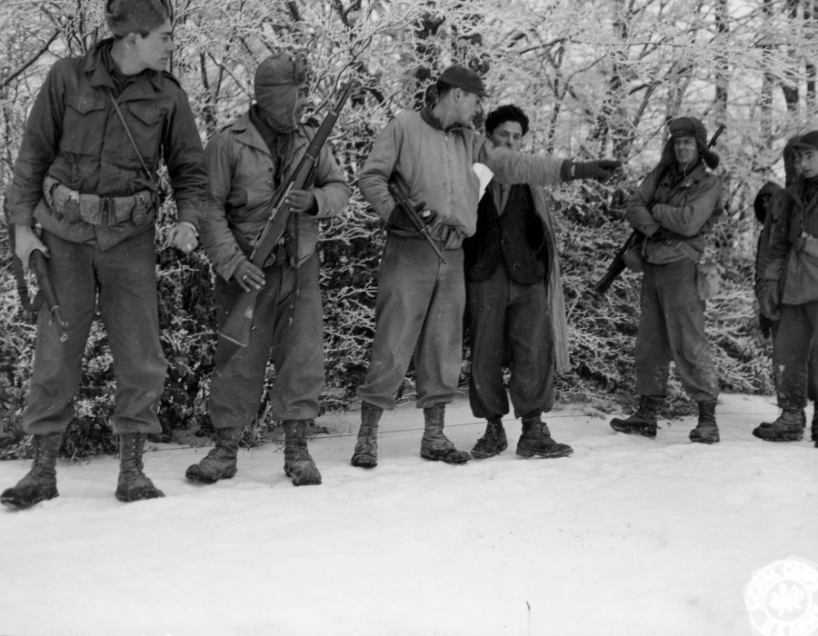 leaving the guide behind  the patrol scouts start to leave the main body of the patrol  as the patrol leader gives directions to his men as to their various jobs.0pianaccio area  italy. 24 december .