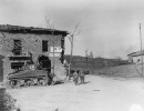 sc 270854   two medics and an infantryman look up road to watch american shell fire on a hill near castel d aiano  during the assault by the 10th mtn. div. of this area. canevaccia 3 march .