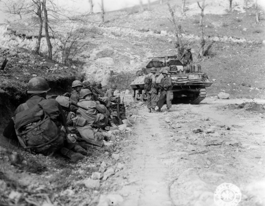 sc 270865   members of the 126th mt. engrs.  10th mt. div.  and a td of the 701st td await their chance to make the yards into tole.