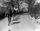 sc 270868   infantrymen of co. i  3rd bn.  85th regt.  10th mtn. div.  march in a column of file up the road to the trucks which will take them to more forward positions. 17 april .